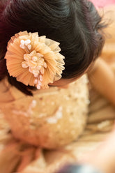 Gold circular hair accessory